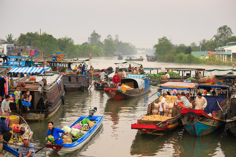 Enjoying the floating market and river life of Vietnamese people in mekong Delta